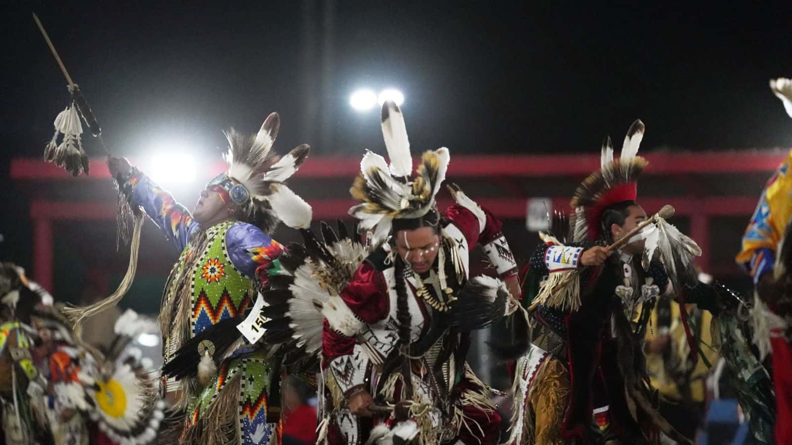 Roughly 60 men’s traditional dancers take part in the G. Russell Gillette Memorial at the UTTC International Powwow, including these participants Sunday, Sept. 7, 2025. (UTTC/Marcus Taken Alive)