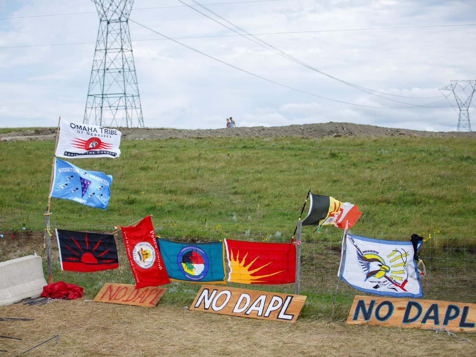 Tribal flags hang on a fence in August 2016 near the construction site of the Dakota Access Pipeline north of Cannon Ball, N.D.