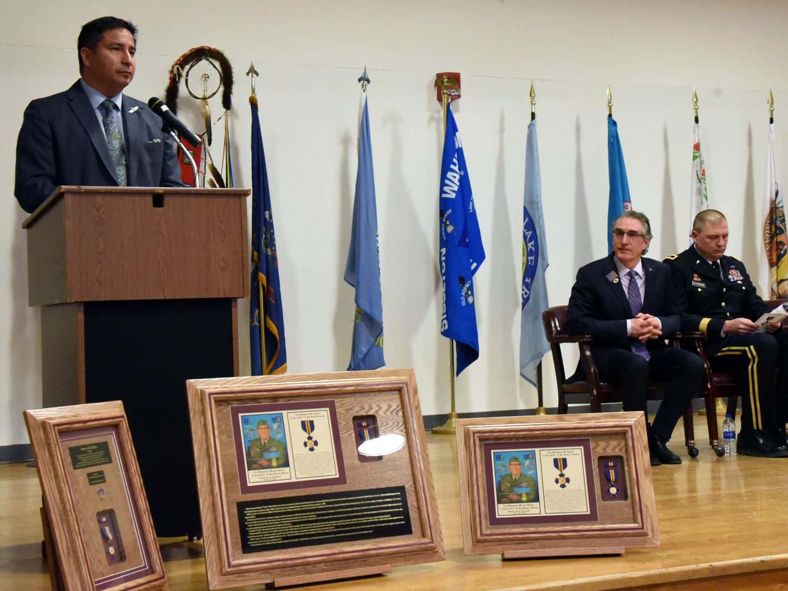Scott Davis (U.S. Department of the Interior);  Scott Davis, in his capacity as the executive director of the North Dakota Indian Affairs Commission, speaks at the Circle of Nations/Wahpeton Indian School in Wahpeton, North Dakota, at an awards ceremony honoring North Dakota Army National Guard members who performed acts of courage and selflessness. Then-governor Doug Burgum sits nearby.