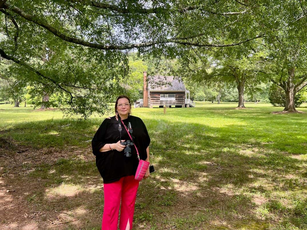 Jodi Rave Spotted Bear, founder and director of the Indigenous Media Freedom Alliance, stands outside the reconstructed Cherokee print shop at New Echota Historical Site on June 4, 2024. The Cherokee Phoenix, the first Native American newspaper, was published in 1828 at the then capital of the Cherokee Nation in New Echota, Georgia.