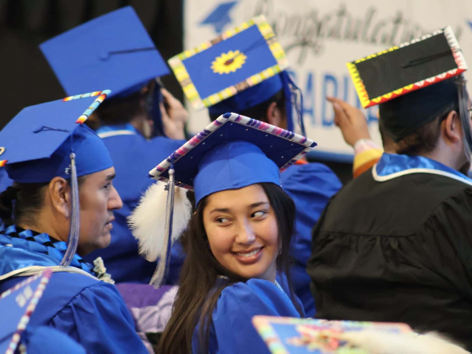 Jalyssa McLaughlin smiles during the Sitting Bull College graduation ceremony on May 14, 2026. McLaughlin, who graduated with a degree in business administration, delivered the student address.