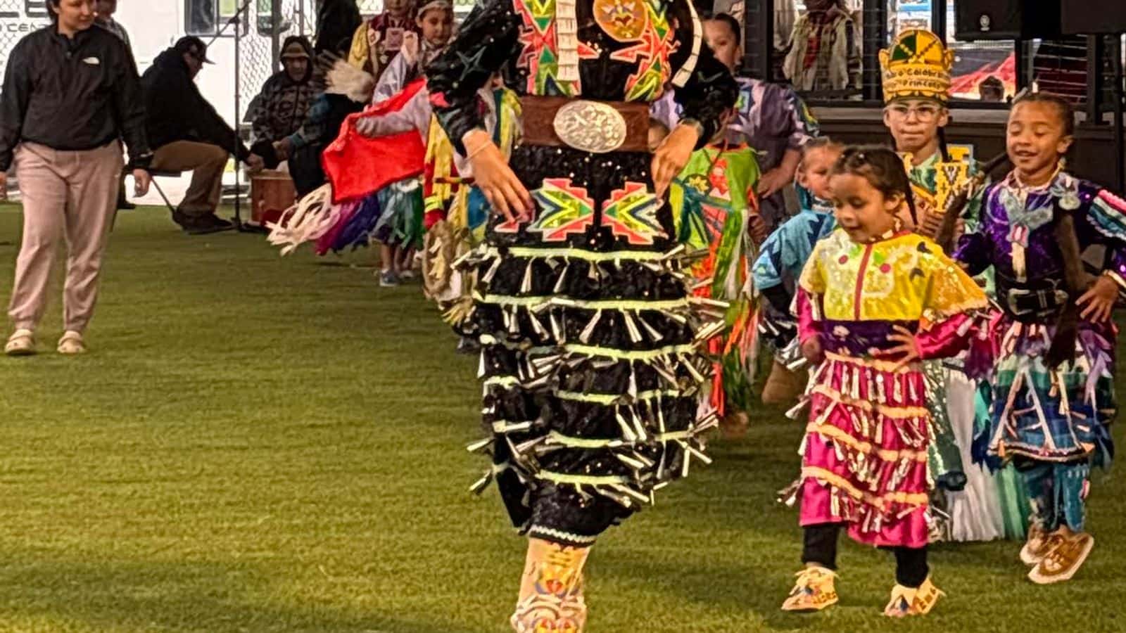 Sarai Coffey leads the Twin Buttes Powwow’s youth night grand entry, June 12. (Photo by Angela Gillette)