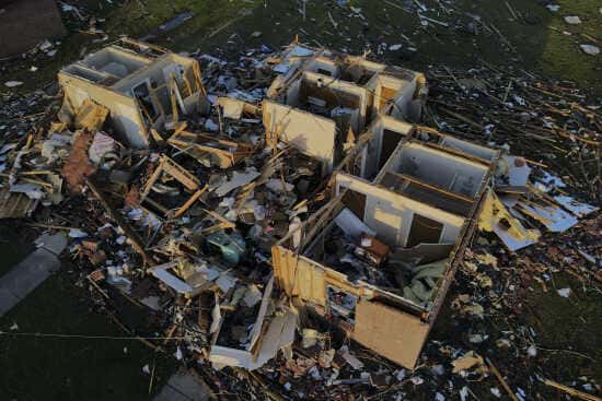 Damage is seen on properties in Rolling Fork, Miss., where three days earlier a tornado ripped through the town, Monday, March 27, 2023, in Rolling Fork, Miss. (AP Photo/Julio Cortez)