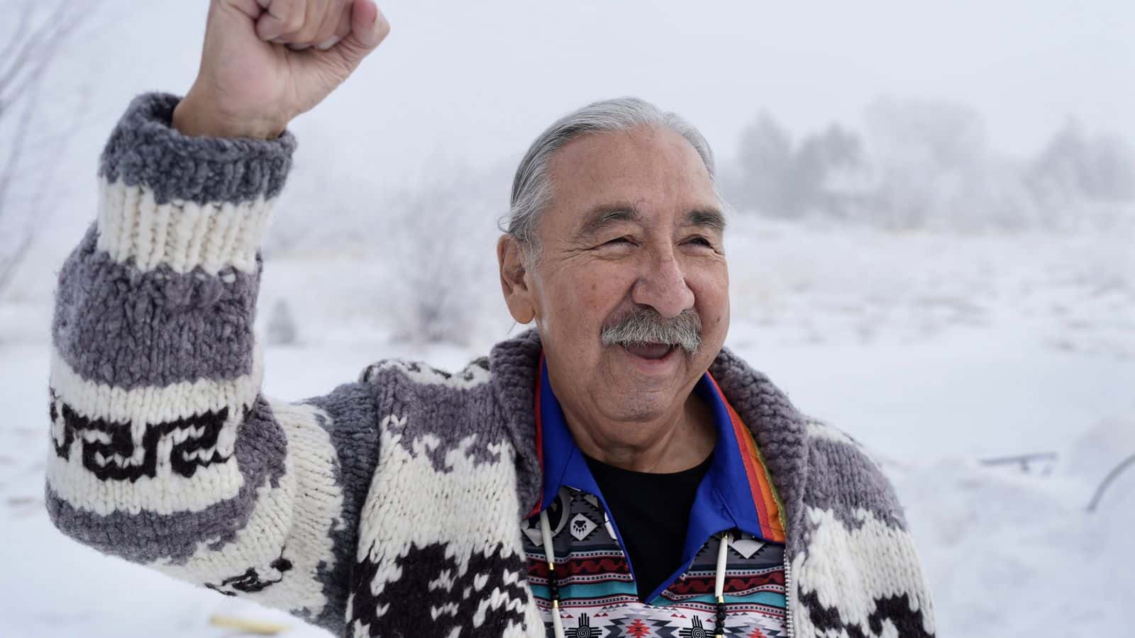 Leonard Peltier stands for a portrait in Belcourt, N.D.