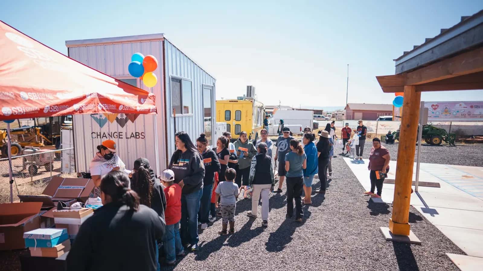 People stand in line to receive free books at an NDN Girls Book Club event in April.