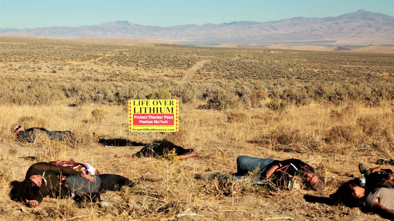 Defenders of sacred burial lands staged a die-in near the planned Thacker Pass Lithium Mine at the Peehee Mu ‘Huh massacre site in northwest Nevada. Photo by Tanya Novikova 