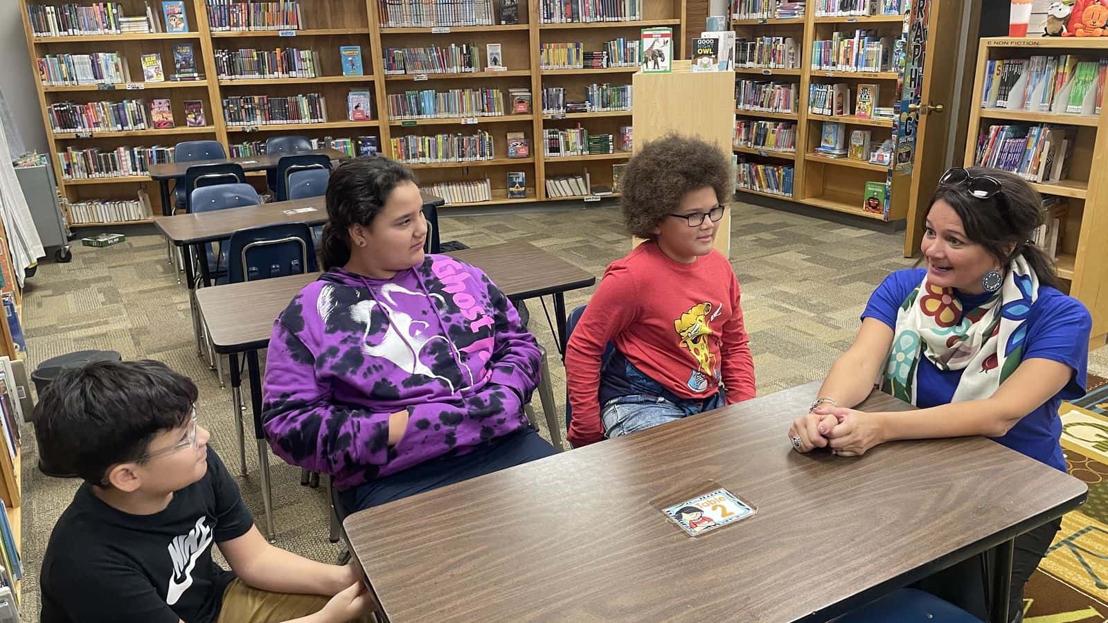 Dawn Quigley visited several schools, including Grimsrud Elementary where she talked with fourth and fifth grade students like Kently Many Horses, Kyrie Provost and Stefan Burton about the meaning behind her books on Oct. 26. Photo credit/ Adrianna Adame
