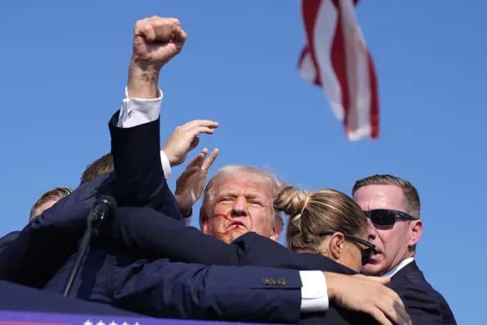 Republican presidential candidate former President Donald Trump is surrounded by U.S. Secret Service agents at campaign rally, Saturday, July 13, 2024, in Butler, Pa. (AP Photo/Evan Vucci)