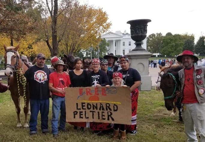 The Leonard Peltier Freedom Riders and their allies deliver a message to President Trump to free Leonard Peltier.(Photo by Frank Hopper.)