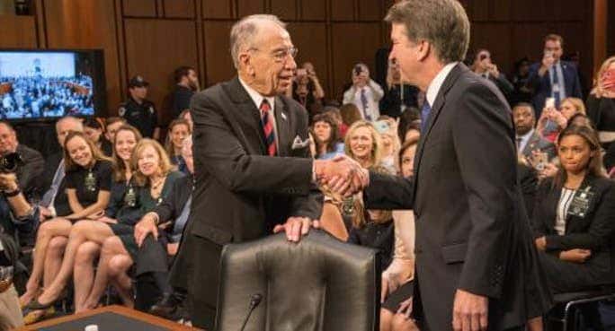 Judiciary Committee Chairman Sen. Chuck Grassley greets Brett Kavanaugh at at hearing. (Photo from Sen. Grasley's official page.)