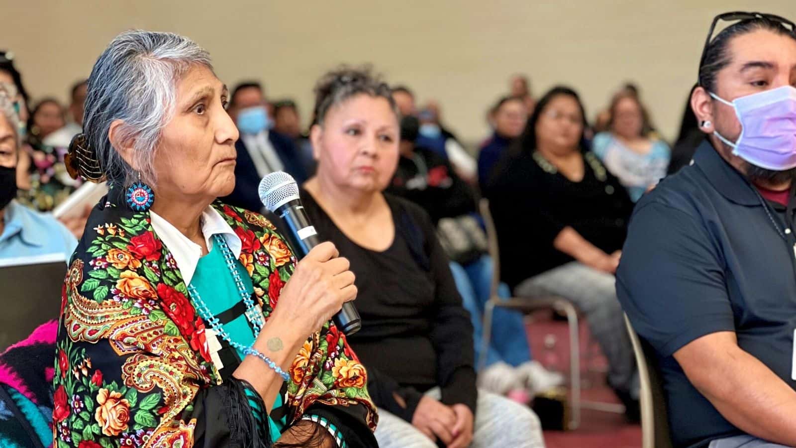  Pershlie Ami, a citizen of the Hopi tribe, shares her experience of attending Phoenix Indian School when she was a kid during the Road to Healing tour hosted by the U.S. Department of Interior at the Gila Crossing Community School on Jan. 20, 2023. Photo by Shondiin Silversmith | Arizona Mirror
