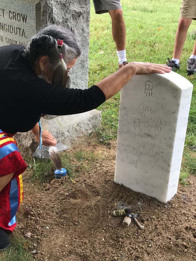 Dr. Roberta Paul parts with her great-great grandfather's headstone after a public ceremony. (Photo by Jourdan Bennett-Begaye)