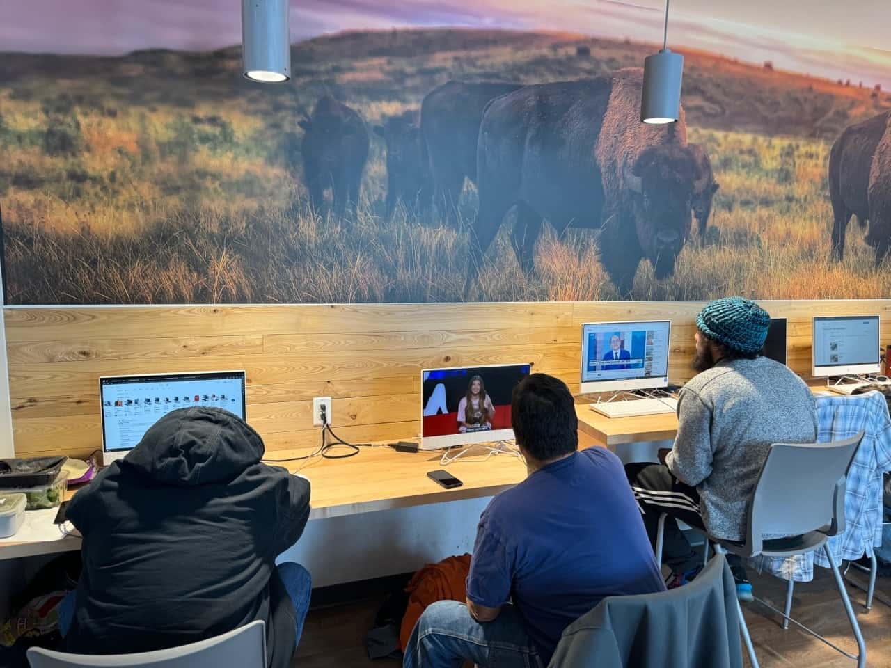Members of the homeless community sheltering from the cold in Bismarck use computers at Missouri Slope Areawide United Way’s Center for Opportunity. (Photo credit, Michael Standaert.)