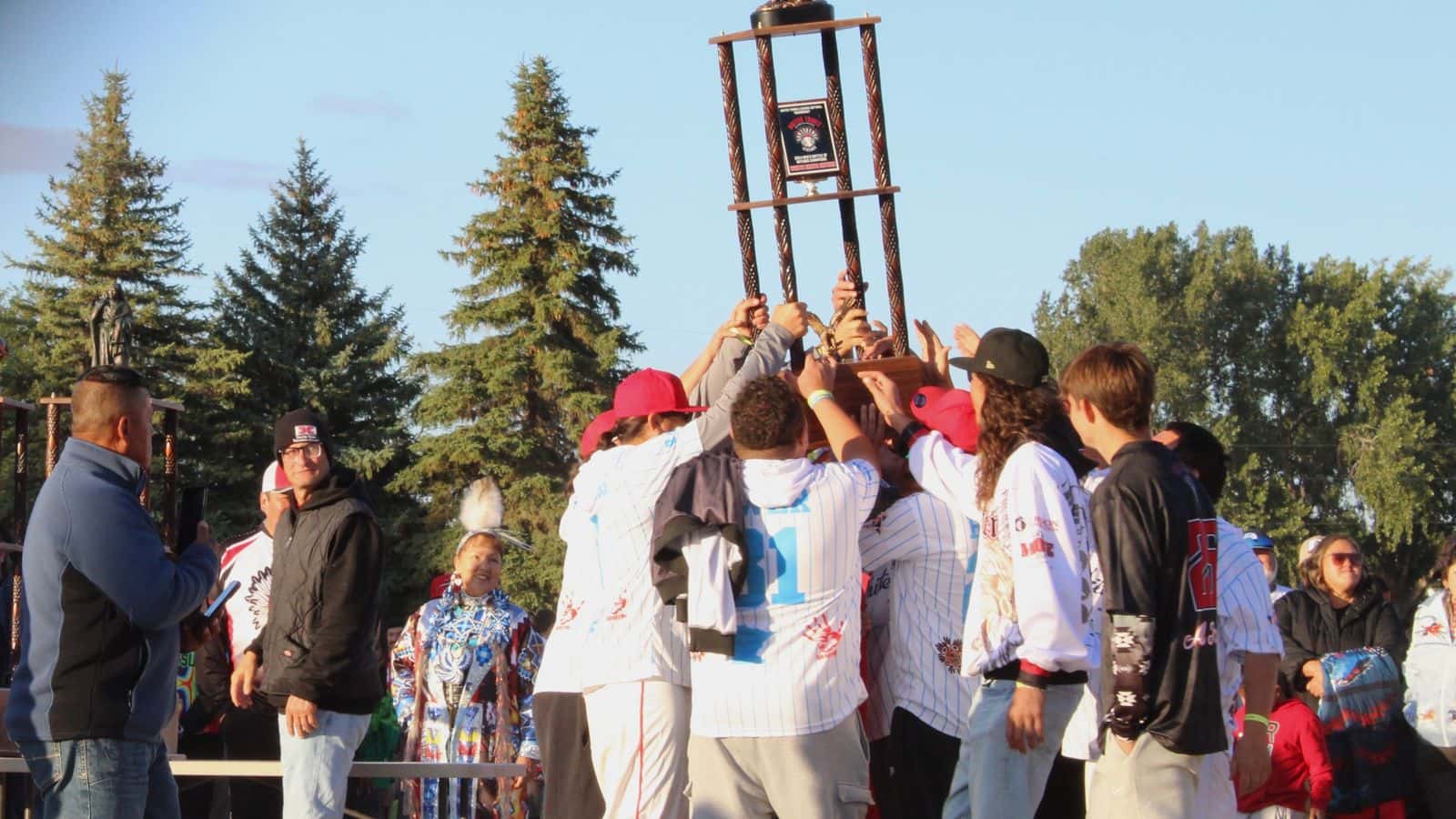 2024 Men’s Battle of Nations champions, White Earth Nation, hoist their trophy in the air. This year’s winners, Sicangu Lakota Oyate, will take home the trophy at next year’s induction ceremony, Bismarck, North Dakota, Sept. 5, 2025. (Buffalo's Fire Photo/Gabrielle Nelson)