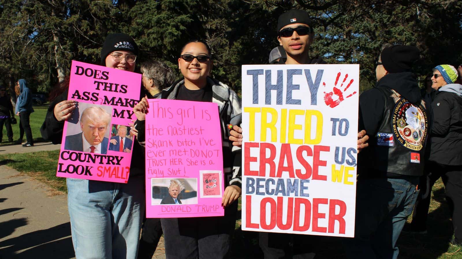 Talihna Romero (Flandreau Santee Sioux Tribe), Presley Heavy Runner (Eastern Shoshone Tribe) and Leon Wright (Rosebud Sioux Tribe) protest in front of the North Dakota State Capitol for the “No Kings” rally, Saturday, Oct. 18, 2025, Bismarck, North Dakota. (Buffalo’s Fire/Gabrielle Nelson)