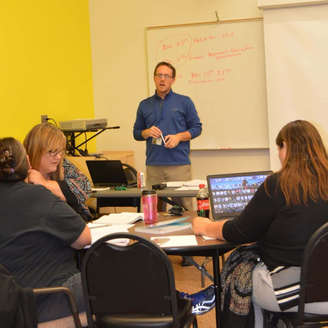 Chris in front of students