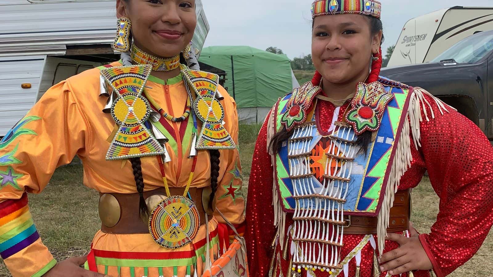 Malaysia White Eagle, 15, right, danced in the Red Dress Special Aug. 1. Her sister, PJ Halsana, 19, left, said she felt great pride watching her sister represent in this important event. (Photo credit: Jolan Kruse) 