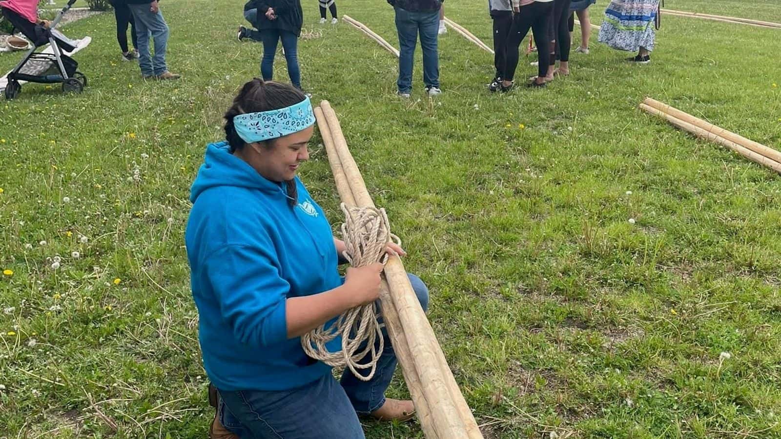 Tyler Rambeau helps build a tipi in Flandreau, South Dakota, spring 2024. (Photo courtesy of Tyler Rambeau)