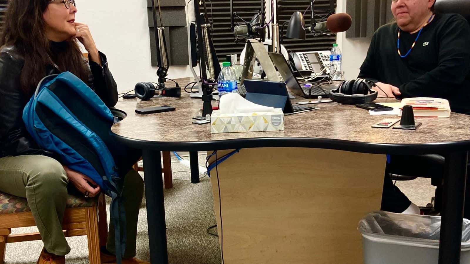 “Native America Calling” host Shawn Spruce talks with writer Deborah Jackson Taffa in the show's Albuquerque studio, April 25. (Photo credit: Art Hughes)
