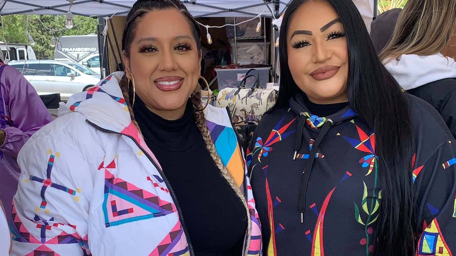 Cece Meadows (left) and Lauren Good Day (right) pose at their booth during the UTTC powwow (Sept. 6.) (Buffalo’s Fire Photo/Jolan Kruse)
