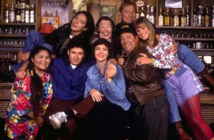 The Emmy-Award winning cast of the popular television series Northern Exposure: The cast, listed clockwise from the far left are: Elaine Miles, Darren E. Burrows, Peg Phillips, John Cullum, Cynthia Geary, Barry Corbin, Janine Turner, and Rob Morrow. Photo: CBS/Photofest