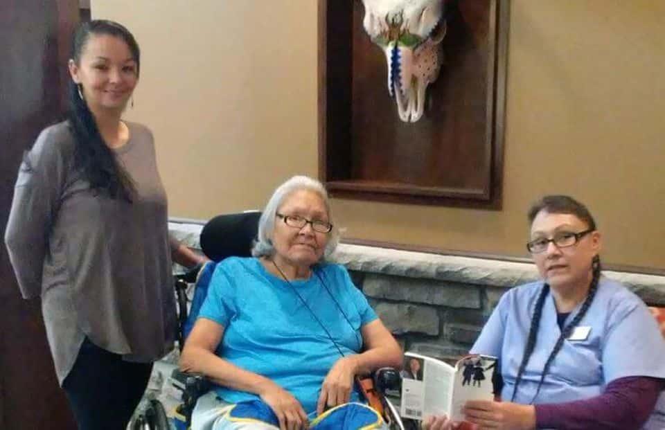 Oglala Sioux Lakota Nursing Home Activities Director Jacque Knight, resident Bernadine Elk Boy and CNA April Two BullsOGLALA SIOUX LAKOTA NURSING HOME
