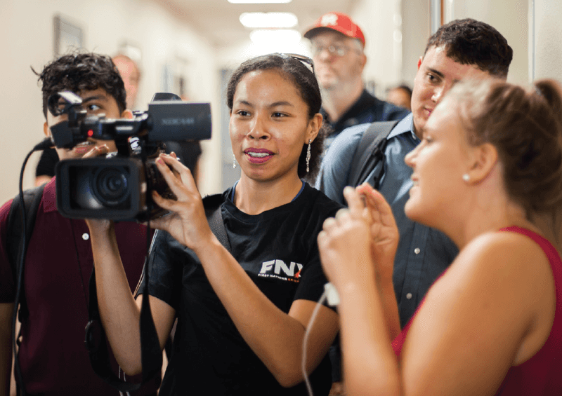 Priestess Bearstops (Oglala Lakota) learns camera-operating skills for broadcast during EIJ17 in Anaheim, Claifornia