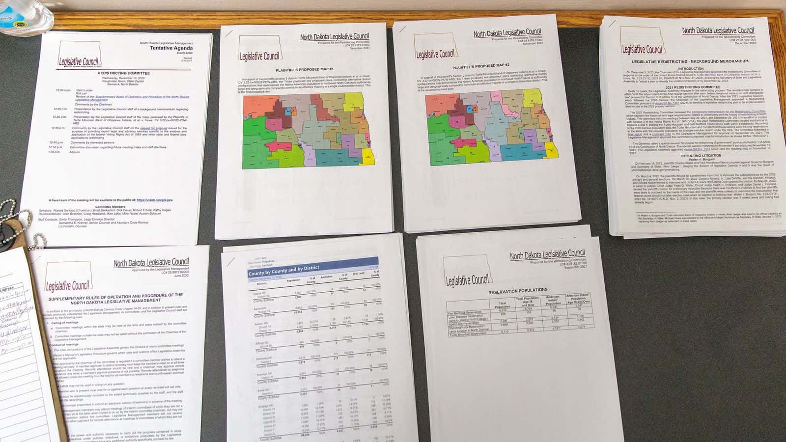  Maps discussed by a North Dakota legislative redistricting committee are displayed at a meeting in December 2023. (Kyle Martin/For the North Dakota Monitor)
