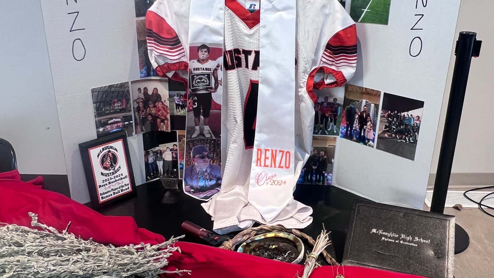 Renzo Bullhead’s family embrace his accomplishments as a leader, athlete and chicken dancer at an altar set up on the United Tribes Technical College campus as seen in this March 24, 2025 photo.