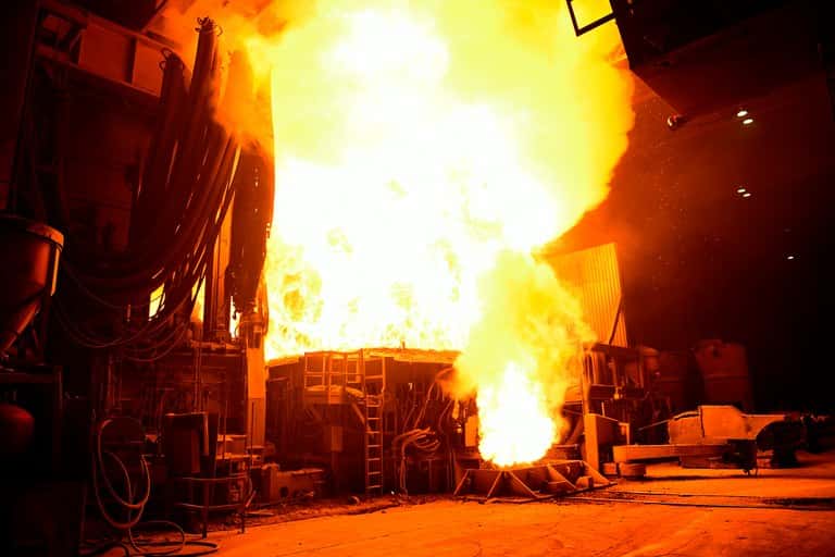 Flames fill the room at EVRAZ Rocky Mountain Steel in Pueblo, Colorado, as steel is processed in an electric arc furnace.
Joe Amon/The Denver Post via Getty Images