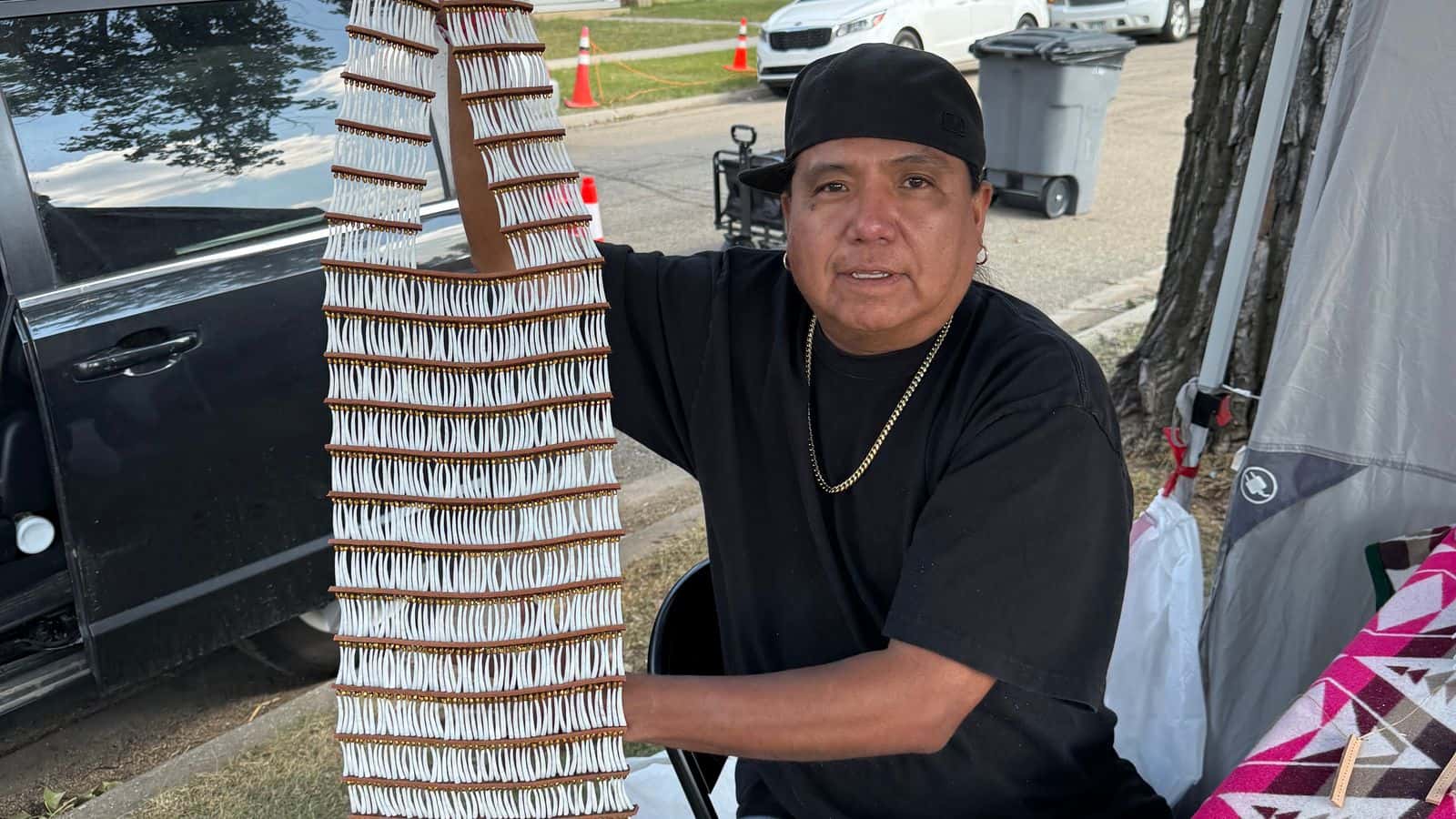 McCloud displays a finished dentalium breastplate he made during the UTTC International Powwow, Bismarck, North Dakota, Saturday, Sept. 6, 2025.