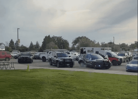 Police cars on the scene at the Mountrail-Williams Electric Cooperative annual meeting in New Town, N.D. after  threats of violence were made against American Indians. 