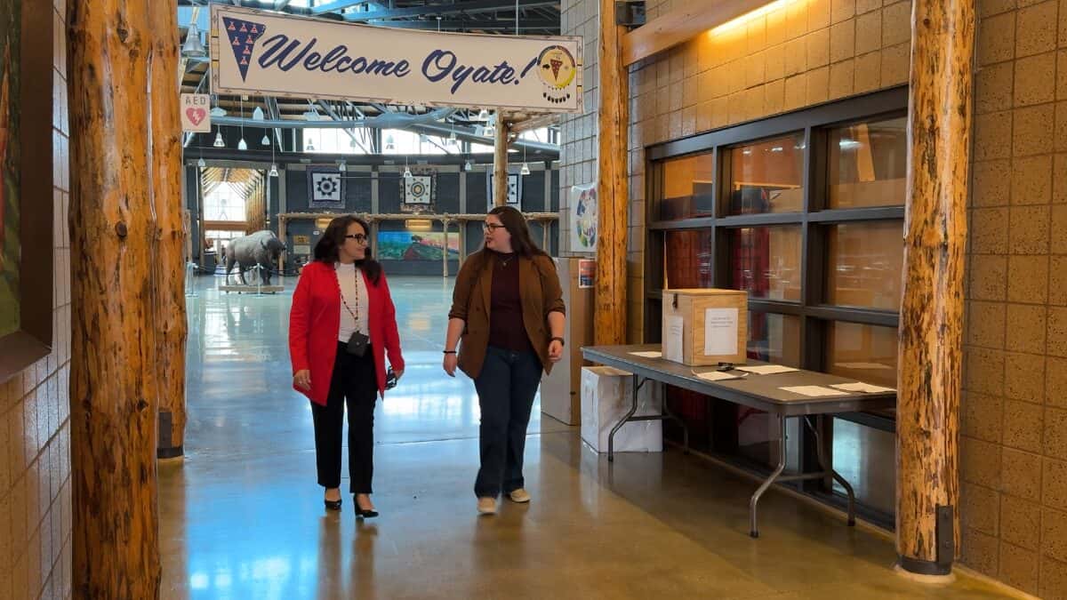 Tamara St. John (left) shows South Dakota Public Broadcast producer Jackie Hendry (right) around the Sisseton-Wahpeton Oyate Tribal Administration Building on Nov. 3, 2024, in Agency Village, S.D. St. John is a member of the South Dakota Native Tourism Alliance. (Photo: Jordyn Henderson / South Dakota Public Broadcasting)