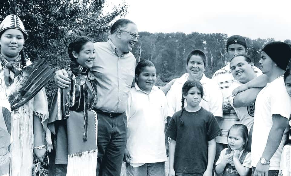 Terry Cross with a group of children attending a NICWA-sponsored community gathering in 2001. (Photo provided by the National Indian Child Welfare Association.)