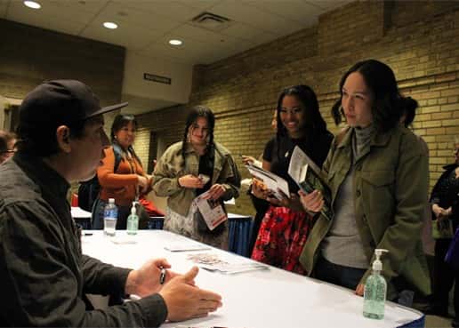 Tommy Orange (left) and Kayla Alkire-Stewart discuss storytelling during a book signing event at Belle Mehus Auditorium on April 28. Photo by: Jodi Rave Spotted Bear