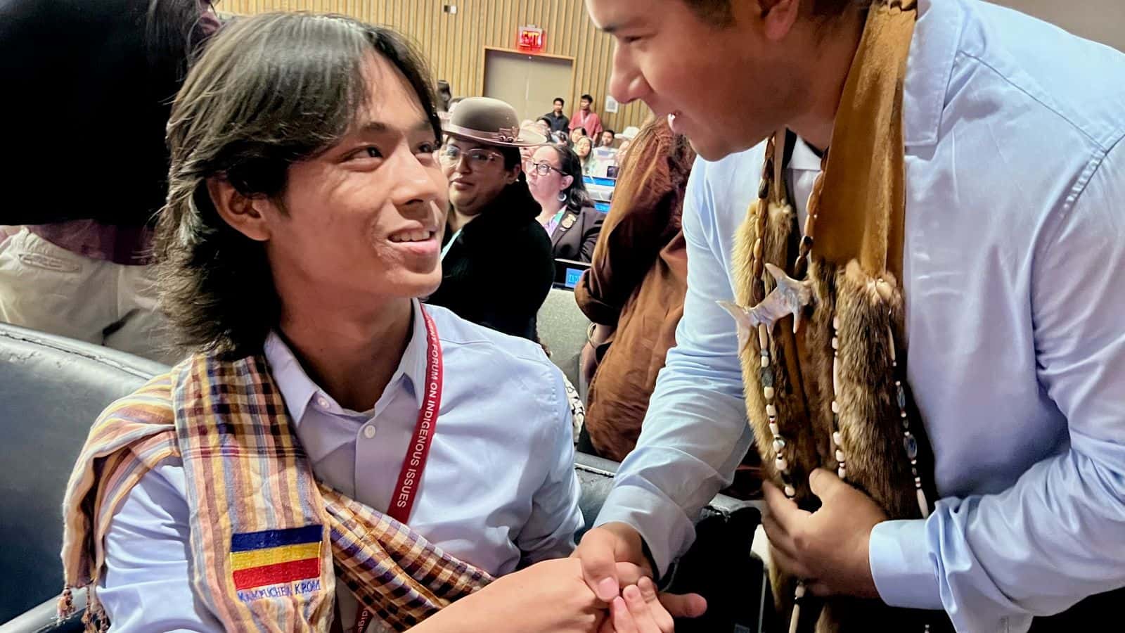 Many participants shook hands with a young leader after he spoke during the general assembly of the United Nations Permanent Forum on Indigenous Issues on April 23, 2025. The UNPFII is scheduled from April 21 to May 2 in New York City. (Photo credit: Jodi Rave Spotted Bear)