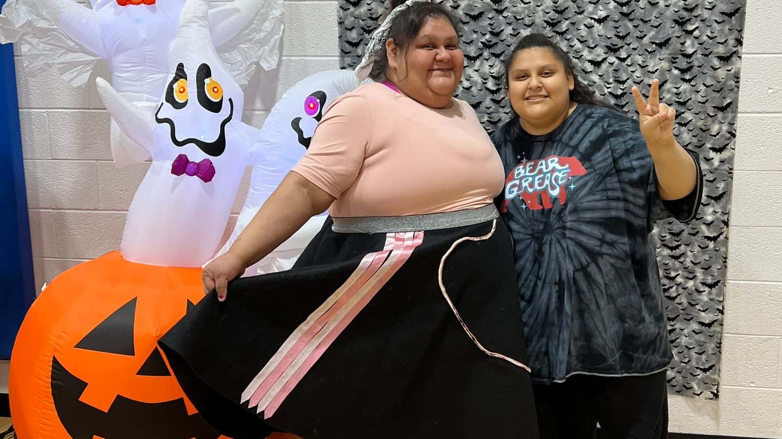 Valerie Siqueiros regularly attends IPAC meetings, council sessions and events with a smile. Here she and her 14-year-old daughter Christina are pictured participating in a Halloween costume contest at Sacred Pipe Resource Center in October 2024. (Photo by Cheryl Kary)