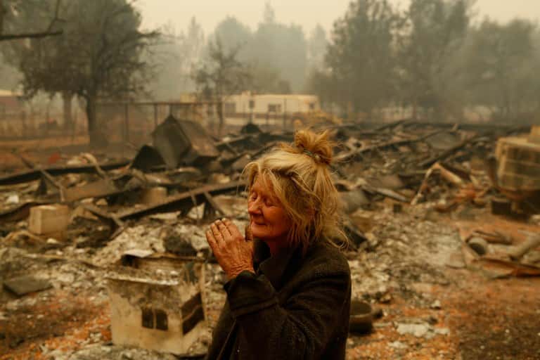 Vulnerable populations such as the elderly face heightened barriers to recovery when fire devastation hits. Paradise, California, resident Cathy Fallon reacts as she stands near the charred remains of her home.
John Locher/AP Images