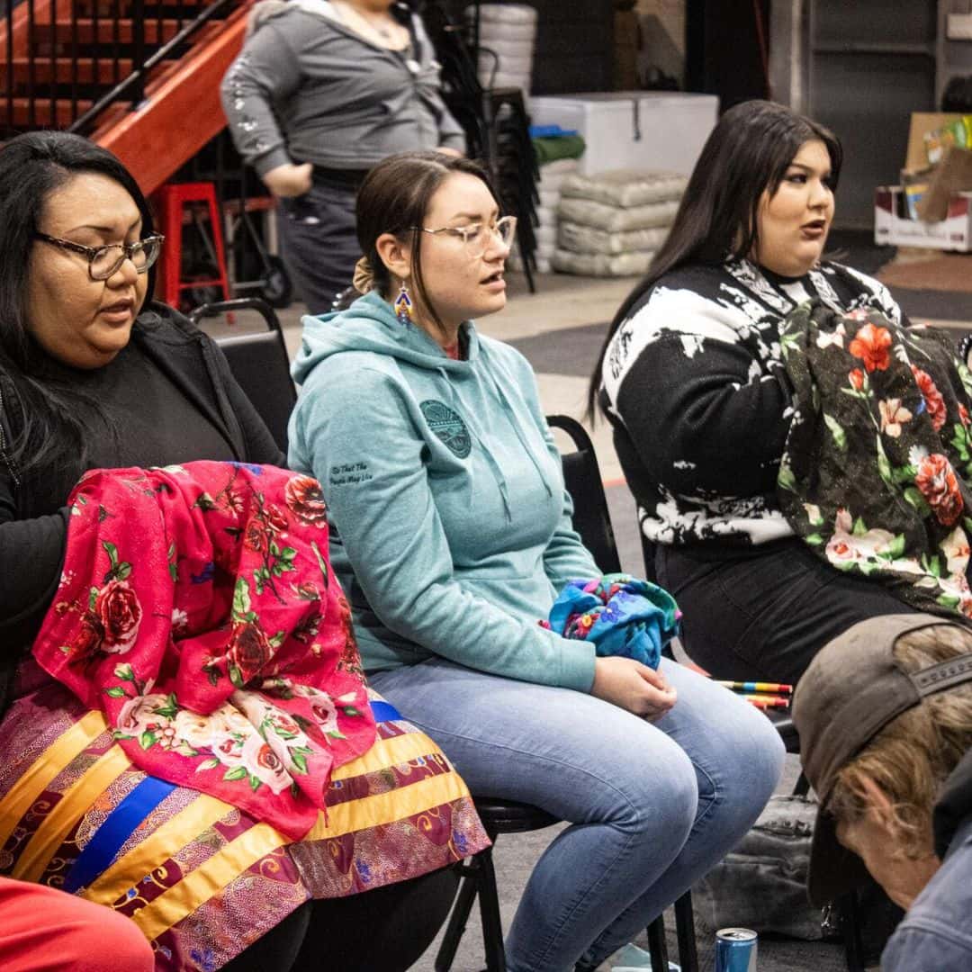 WomenSitting Handgames