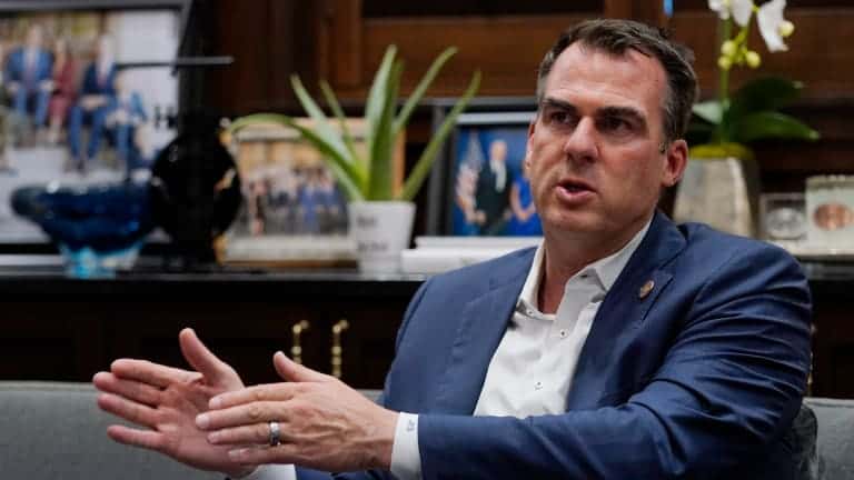 Oklahoma Gov. Kevin Stitt is pictured during an interview in his office Wednesday, Aug. 3, 2022, in Oklahoma City. The Oklahoma Board of Pardon and Parole has recommended clemency for death row inmate James Coddington. Stitt said that he hasn't been formally briefed on Coddington's case, but that with any clemency recommendation, he meets with prosecutors, defense attorneys and the victim's family before making a decision. (AP Photo/Sue Ogrocki)