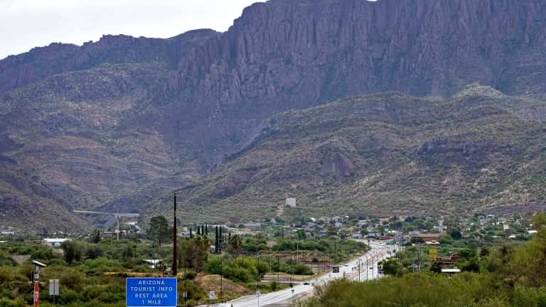 Apache Leap Mountain hovers over Superior, Ariz., Friday, June 9, 2023. The historic mining town in central Arizona is the subject of a tug of war between locals who want a copper mine developed nearby for economic benefit and Native American groups who say the land needed for mining is sacred and should be protected. (AP Photo/Matt York)