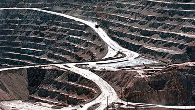 Terraces cut into the hillside at the huge Santa Rita copper mine in Grant County, N.M., are shown in this March 1999 file photo. The Biden administration is recommending changes to a 151-year-old law that governs mining for copper, gold and other hardrock minerals on U.S.-owned lands, including making companies pay royalties on what they extract. (Richard Pipes/The Albuquerque Journal via AP, File)