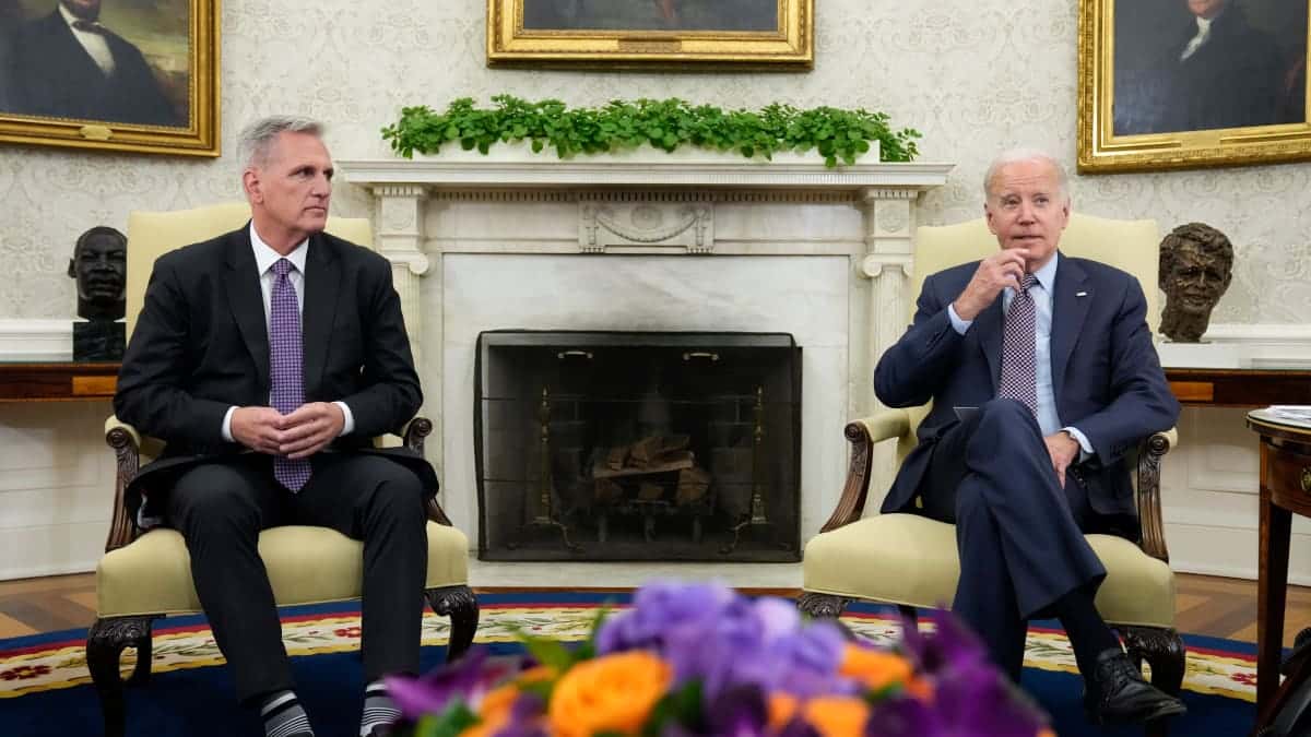 After weeks of negotiations, President Joe Biden and House Speaker Kevin McCarthy — shown here in the Oval Office on May 22, 2023 — have struck an agreement to avert a potentially devastating government default. The stakes are high for both men, who will now have to persuade lawmakers in their parties to vote for the deal. (AP Photo/Alex Brandon)