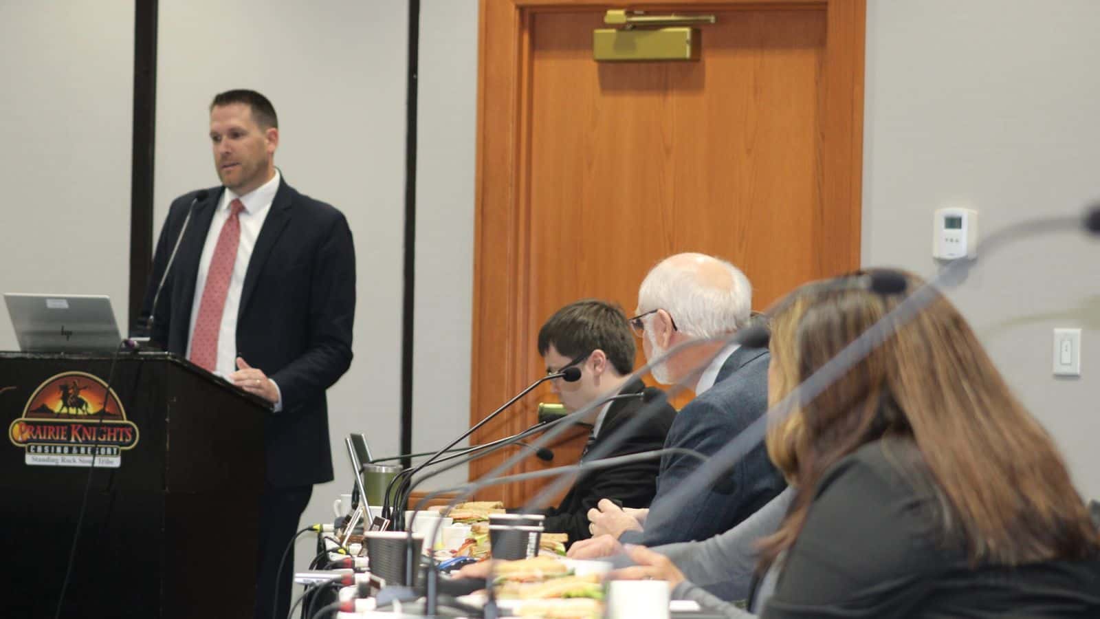  Members of the North Dakota Legislature listen as Secretary of State Michael Howe speaks on efforts to improve access to voting on tribal reservations at a Tribal and State Relations Committee at Prairie Knights Casino on Oct. 9, 2024. (Mary Steurer/North Dakota Monitor)