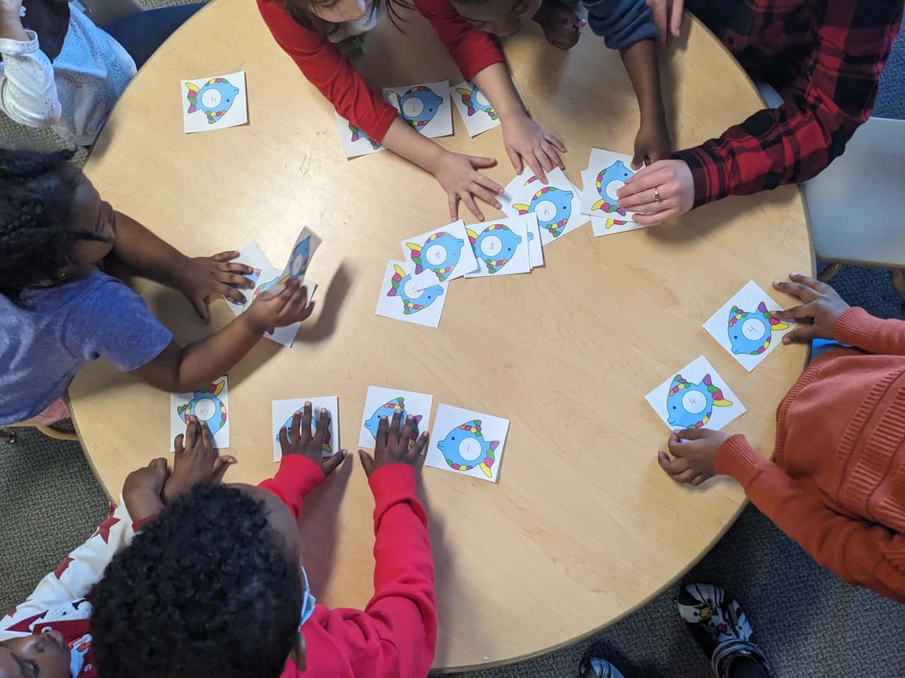 According to analysis of the most recent data by Kids Count North Dakota, child care capacity only meets 81 percent of the needs in the state with costs running close to $10,000 per year for infant day care. Here, children play a numbers game at Jasmin Child Care and Preschool in Fargo. Photo courtesy of Jasmin Child Care.