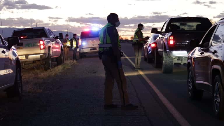The Navajo Police Department has been holding checkpoints to share information about the curfew order on the Navajo Nation. (Courtesy of Farmington Daily Times/Noel Lyn Smith)