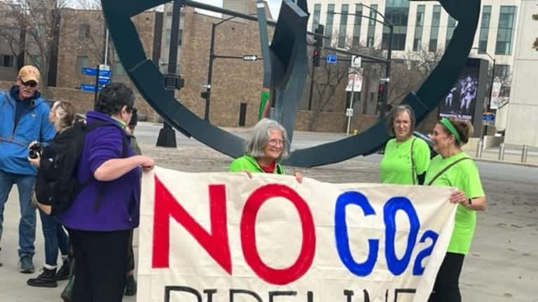 Opponents of liquid carbon pipelines rally Nov. 9, 2022, in Cowles Commons in downtown Des Moines. (Kathie Obradovich/Iowa Capital Dispatch)