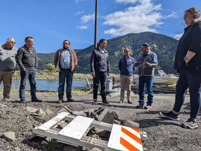 U.S. Department of the Interior Assistant Secretary for Indian Affairs Bryan Newland, center, listens to an employee of the Columbia River Inter-Tribal Fish Commission at the Cooks Landing in-lieu site along the Columbia River on May 3. Photo by Chris Aadland/Underscore.news and Indian Country Today

Underscore.news