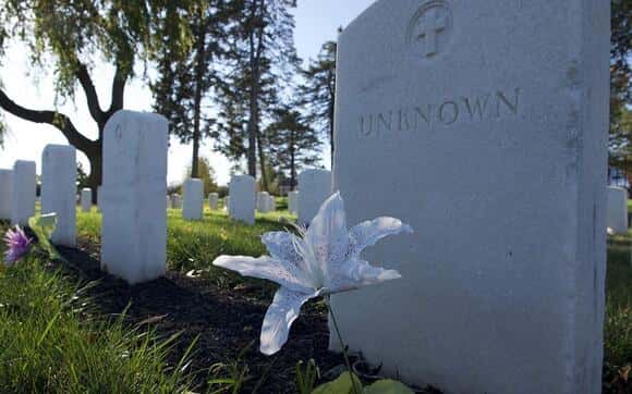 A tombstone of an unknown student that attended the Carlisle Indian Industrial School sits on the grounds of the present-day U.S. Army War College. The proposed Truth and Healing Commission would be charged with investigating unmarked grave sites and other abuses of the Indian boarding school system. (File photo by Addison Kliewer/Gaylord News)