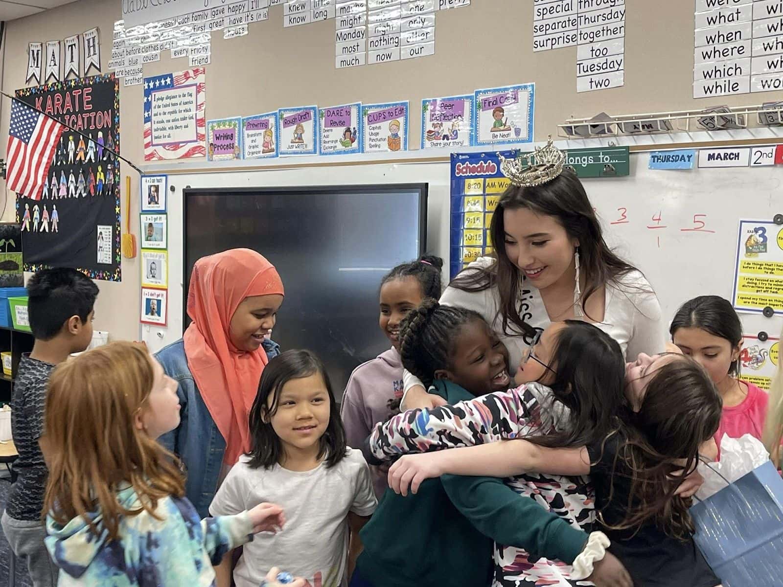 Children hugging Gabriella